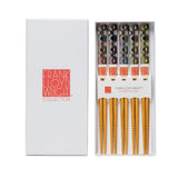 Set of chopsticks in a Frank Lloyd Wright Collection box on a white background