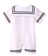 White sailor baby romper with navy trim on a white background