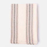 A folded striped towel in red, black and cream.