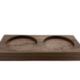 A rectangular wooden tray with two circular recessed bowls, shown on a plain white background.
