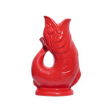 Red ceramic fish-shaped vase pitcher on a white background