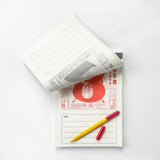 Calendar with a red and yellow pen on a white background