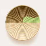 Woven basket with a gradient color design on a white background