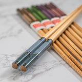 Set of wooden chopsticks on a marble surface