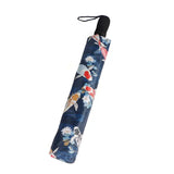 Foldable umbrella with koi fish and floral design on a blue background