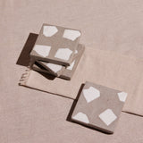 Set of four handcrafted Terrazzo Coasters in neutral colors.