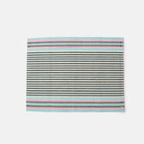 A handwoven placemat featuring a striped pattern in beige, pink, green, and blue.