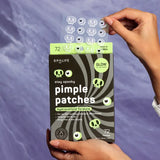 Spalife pimple patches packaging held by a hand against a purple background
