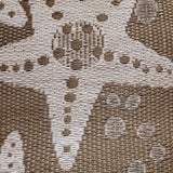 Close-up of a textured fabric with a pattern of shapes and lines.