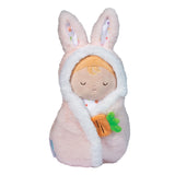 Plush toy resembling a baby in a bunny outfit on a white background