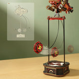 Mechanical model on a stand with a green background