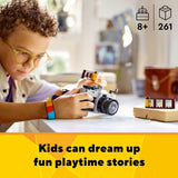 Child playing with a toy camera and building set, with text 'Kids can dream up fun playtime stories'.