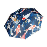 Umbrella with koi fish and floral design on a blue background
