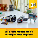 Three retro-themed toy models on a table with a yellow banner displaying '3in1'.