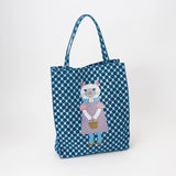 Tote bag with a cat design on a blue and white patterned background