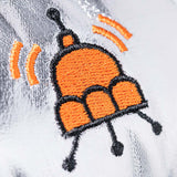 Embroidered design on a silver fabric background