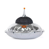 Silver UFO-shaped object with a black top on a white background