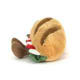 Plush toy shaped like a sandwich with a smiling face on a white background
