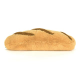 Plush toy shaped like a sandwich on a white background