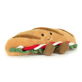 Plush toy shaped like a sandwich with a smiling face on a white background