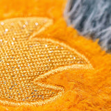 Close-up of orange fabric with textured pattern.