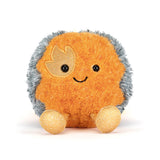 Plush toy comet with a smiling face on a white background