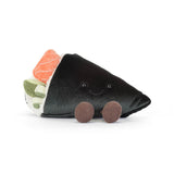 Stuffed toy resembling a sushi roll with black exterior, orange and green fillings on a white background