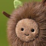 Plush toy with a smiling face on a white background
