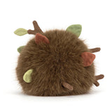 Plush toy resembling a brown creature with green accents on a white background