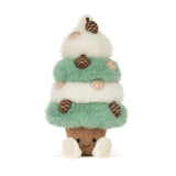 White and green plush tree covered in pinecones. Has a corded tan trunk with a smiling face embroidered on it.