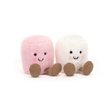 Two plush toy marshmallows, one pink and one white, with embroidered eyes and feet, seated next to each other.