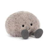 Plush toy resembling a round small stone with a smiling face on a white background
