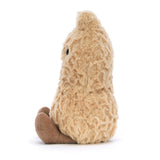 A soft plush toy resembling a peanut with a beige body, brown boots, and a smiling face.
