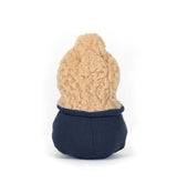 Small plush toy with a beige top and navy bottom on a white background