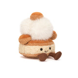 Plush toy resembling a pastry with brown and white colors on a white background