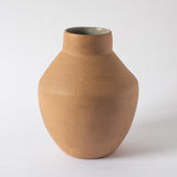 Beige stoneware vase set against a white background.