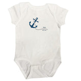 White baby onesie with blue anchor design on a white background
