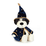 A plush dog toy dressed as a wizard, featuring a navy blue velvet robe and pointed hat with gold star patterns and trim, set against a plain white background.