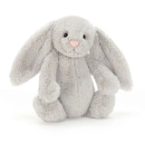 Plush gray bunny toy with a pink nose on a white background