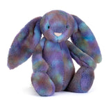 Multicolored plush bunny toy on a white background