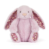 Pale purple plush bunny with floral ears and feet on a white background