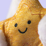 Gold star-shaped plush toy with a smiley face on a white background