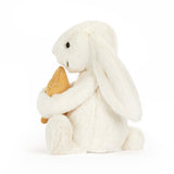 White plush bunny holding a gold star on a white background