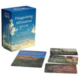 The game box and several cards for 'Disappointing Affirmations: The Game' by Dave Farmasowski, displayed on a clean white background.
