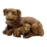 Dog with puppy netsuke, or Japanese toggle figurine on a white background