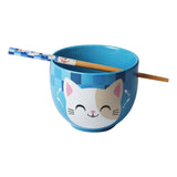 Blue ceramic bowl with cat design and chopsticks on a white background