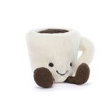 Plush toy espresso cup with a smiling face on a white background