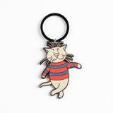 A cartoon cat keychain charm with a black circular ring, featuring a white cat wearing a red and blue striped sweater, set against a plain white background.