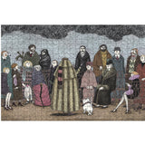 A completed jigsaw puzzle showing an illustrated crowd scene with people in winter clothing under a dark sky, photographed against a plain white background.