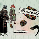 Vintage-style illustration featuring two people in winter clothing holding pieces of a multicolored patterned fruitcake, with a large sign reading 'Fruitcake' and a dog carrying a piece on a pale patterned background.